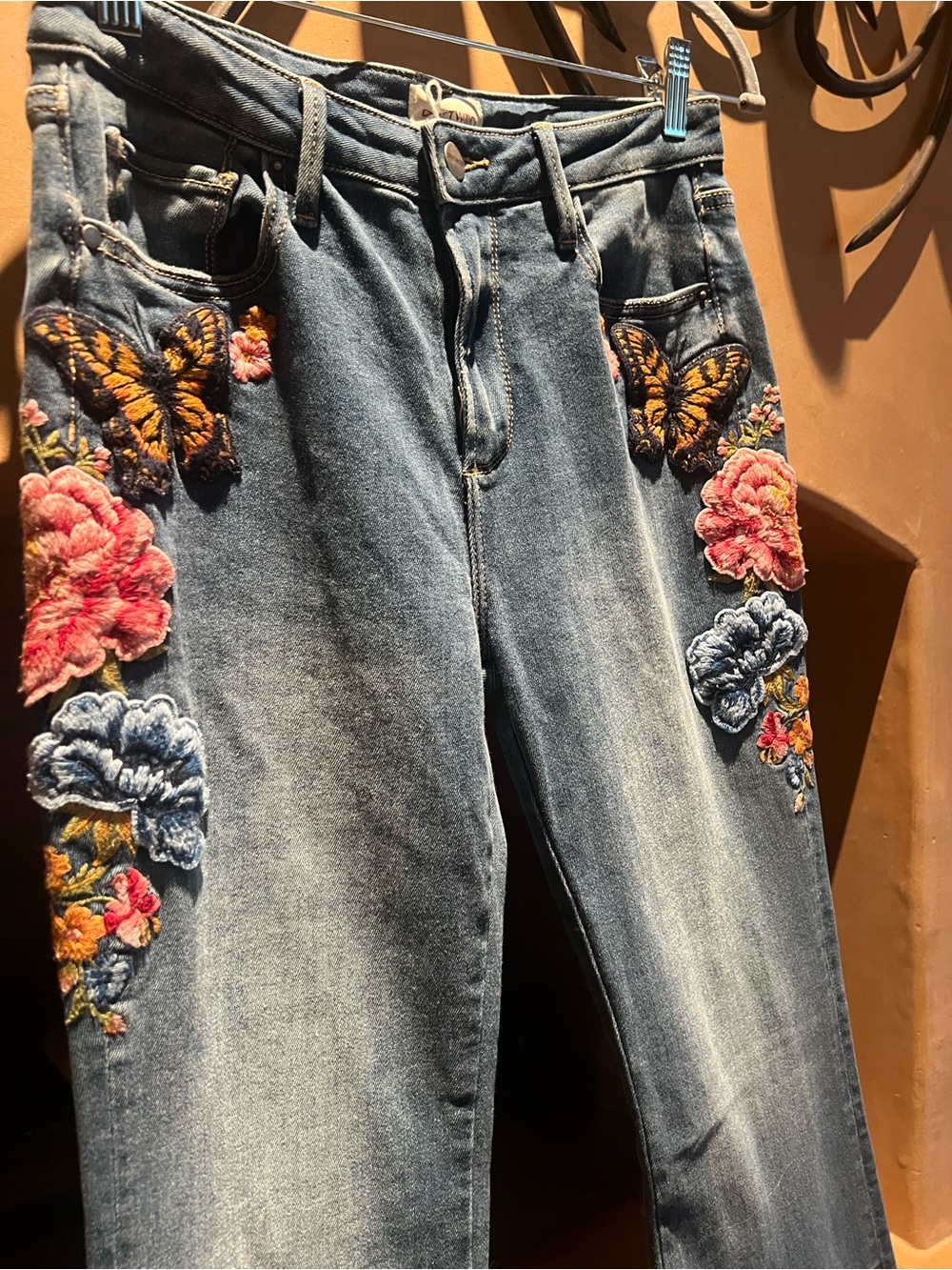 DRIFTWOOD Blue Denim Flare Jeans with Embroidered Floral & Butterfly Accents - Picture 2 of 5